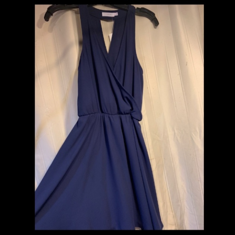 LUSH navy dress with wrap front and back. Beautiful fit for all your events